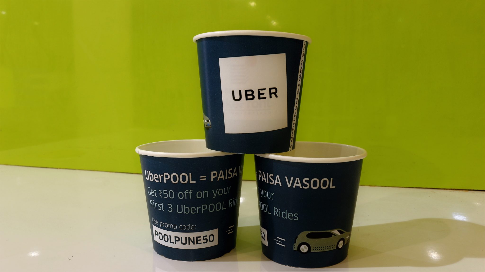uberpool paper cup advertising campaign with offers and promo codes gingercup