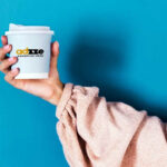The image is showing adzze advertisement on paper cup