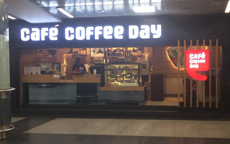 This image shows a Cafe Coffee Day outlet at a busy place