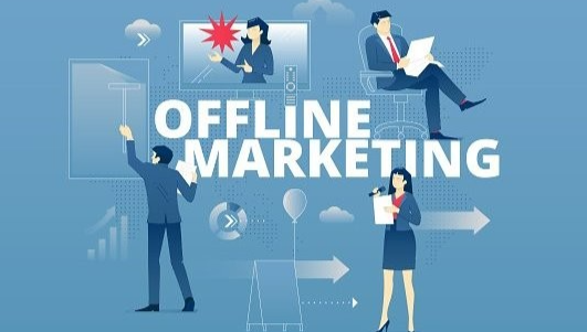 A picture where "offline marketing" is written in the middle, and four people are carrying offline marketing activities around it.