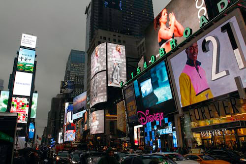Billboards advertising various brands.
