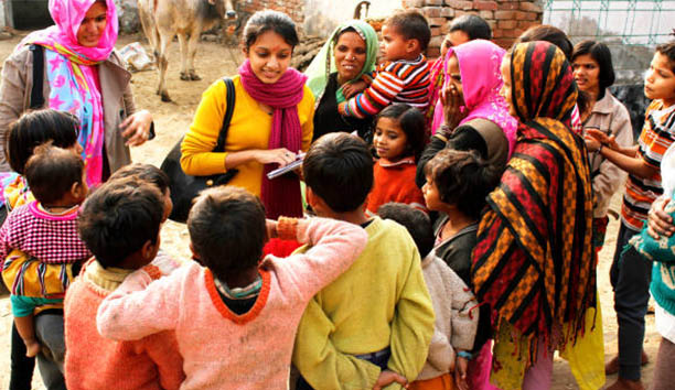 Two volunteers meeting children for social causes
