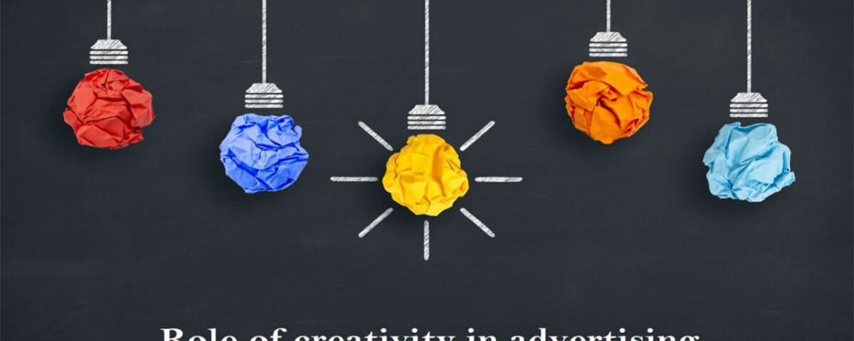 Five coloured bulbs on a black background.