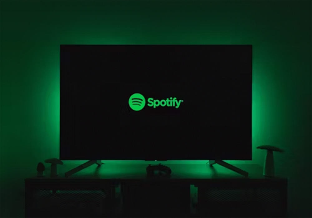 The Spotify icon on a monitor screen.
