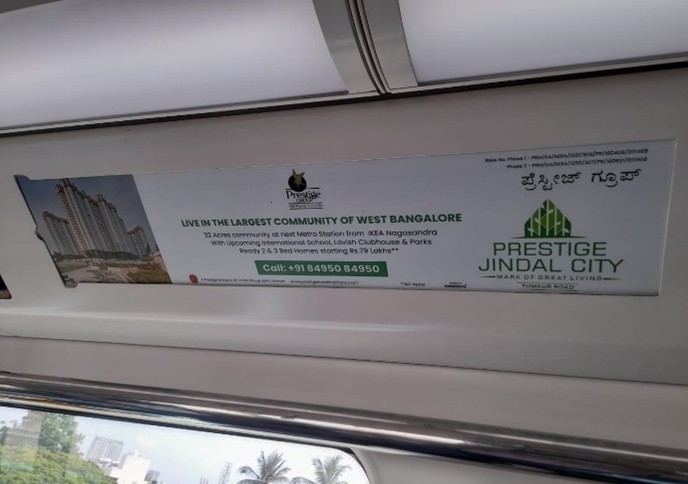 Interior transit advertisement panel promoting a residential real estate project