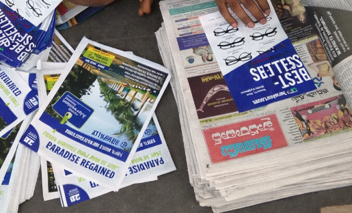Newspaper Insert Advertising Flyers Stack of printed newspaper flyers and paper inserts used for local promotions