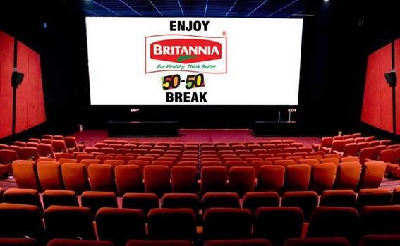 Cinema Advertising Screen Branding Cinema hall screen displaying Britannia 50-50 brand advertisement before a movie