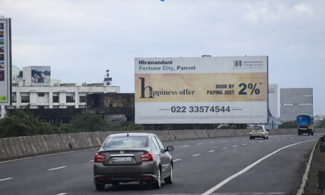 Highway Billboard For Hiranandani Fortune City Highway view with a large Hiranandani Fortune City Panvel billboard and passing cars