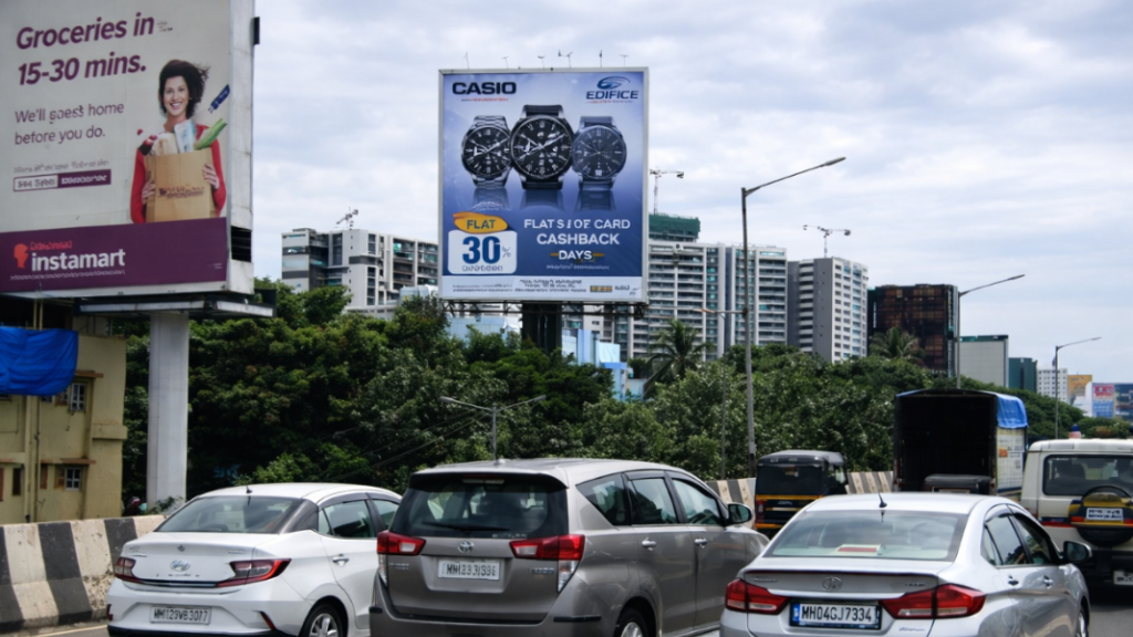 Casio Edifice highway billboard advertising with promotional cashback offer Casio Edifice watches billboard on highway with cashback offer targeting urban commuters
