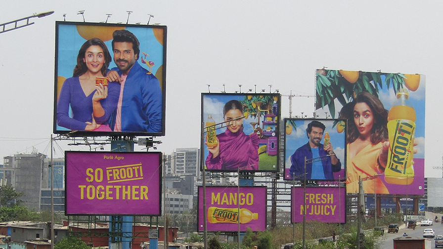 Frooti outdoor billboard campaign with multiple hoardings Multiple Frooti mango drink billboards on highway showcasing large scale outdoor advertising
