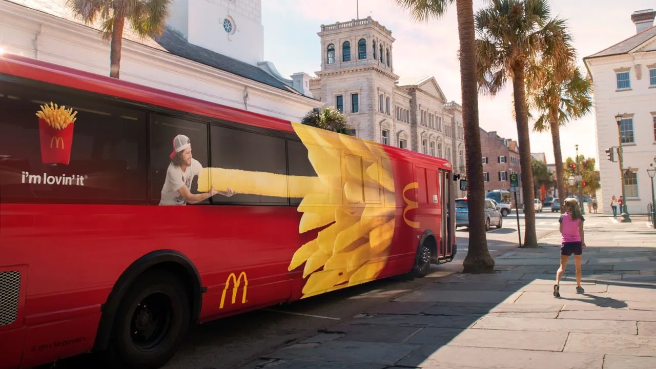 McDonald’s transit advertising on bus wrap campaign McDonald’s bus branding campaign with creative fries visual on public transport vehicle