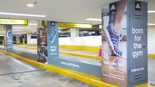 Parking Area Advertising for Repeated Brand Exposure parking lot branding with pillar ads and wall graphics targeting daily commuters